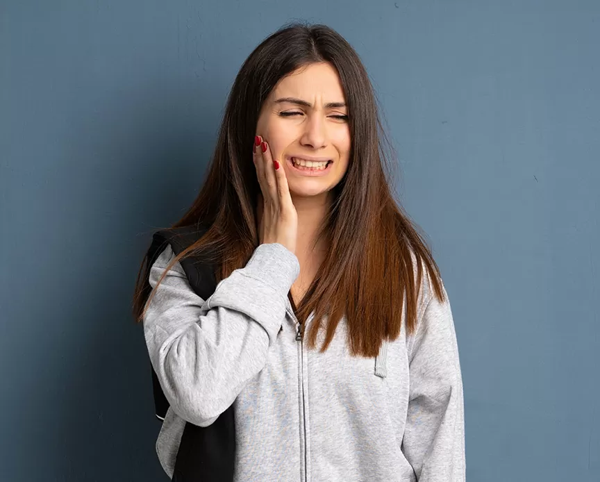 Young sport woman with toothache