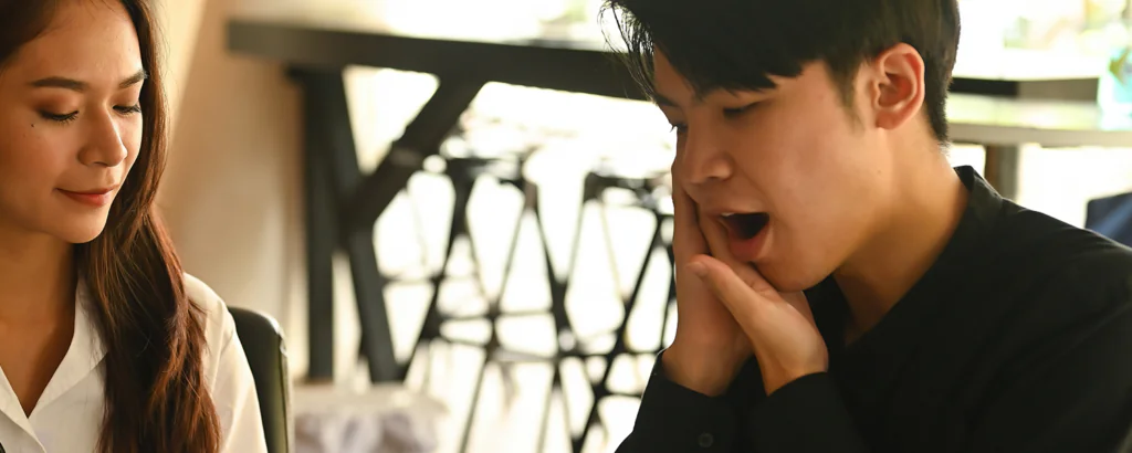 young man suffering from toothache